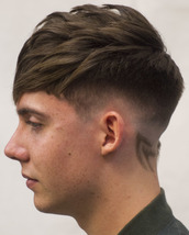 Asymmetric crop spikes Asymmetric cropped fringe with spiked texture and shaved pattern.