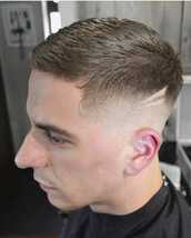 mid fade mid fade with a comb over and tiger scratches