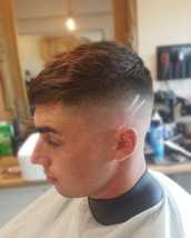 Sliced up Bald fade finished with two slices. Textured throughout apex.