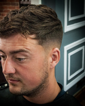 Texture Fade Long messy texture on top with a skin fade