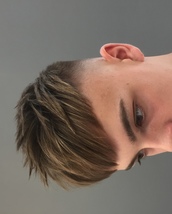 Textured sweep fade Skinfade with swept fringe and spiked textured hair.